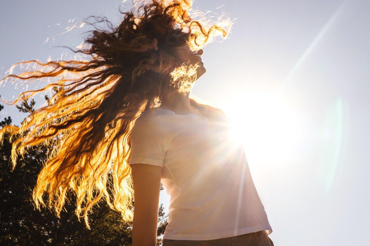 Happy girl with long hair in sunshine 2023 11 27 05 07 30 utc