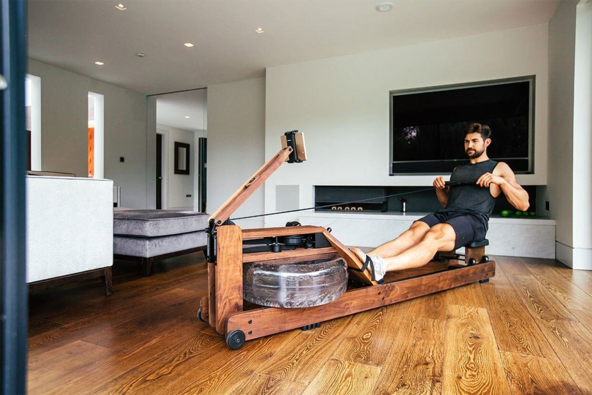 Man using ergatta rower at home jpeg