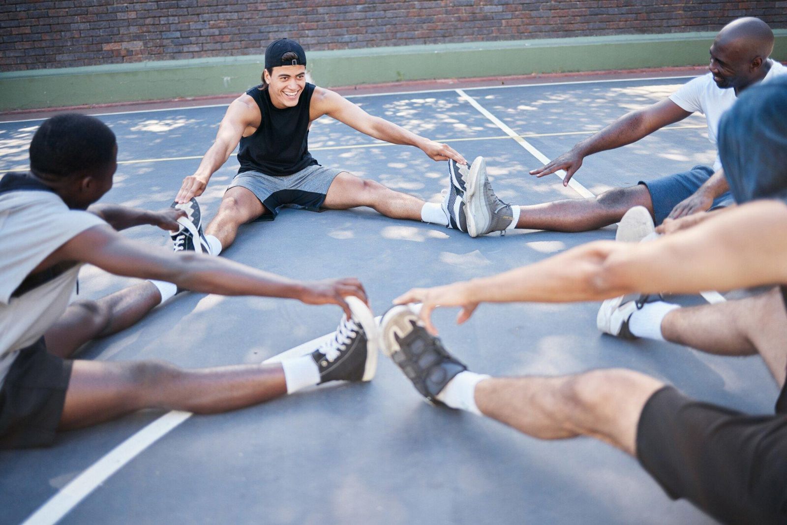 Resize fitness men stretching on outdoor sport court wit 2023 11 27 05 14 40 utc