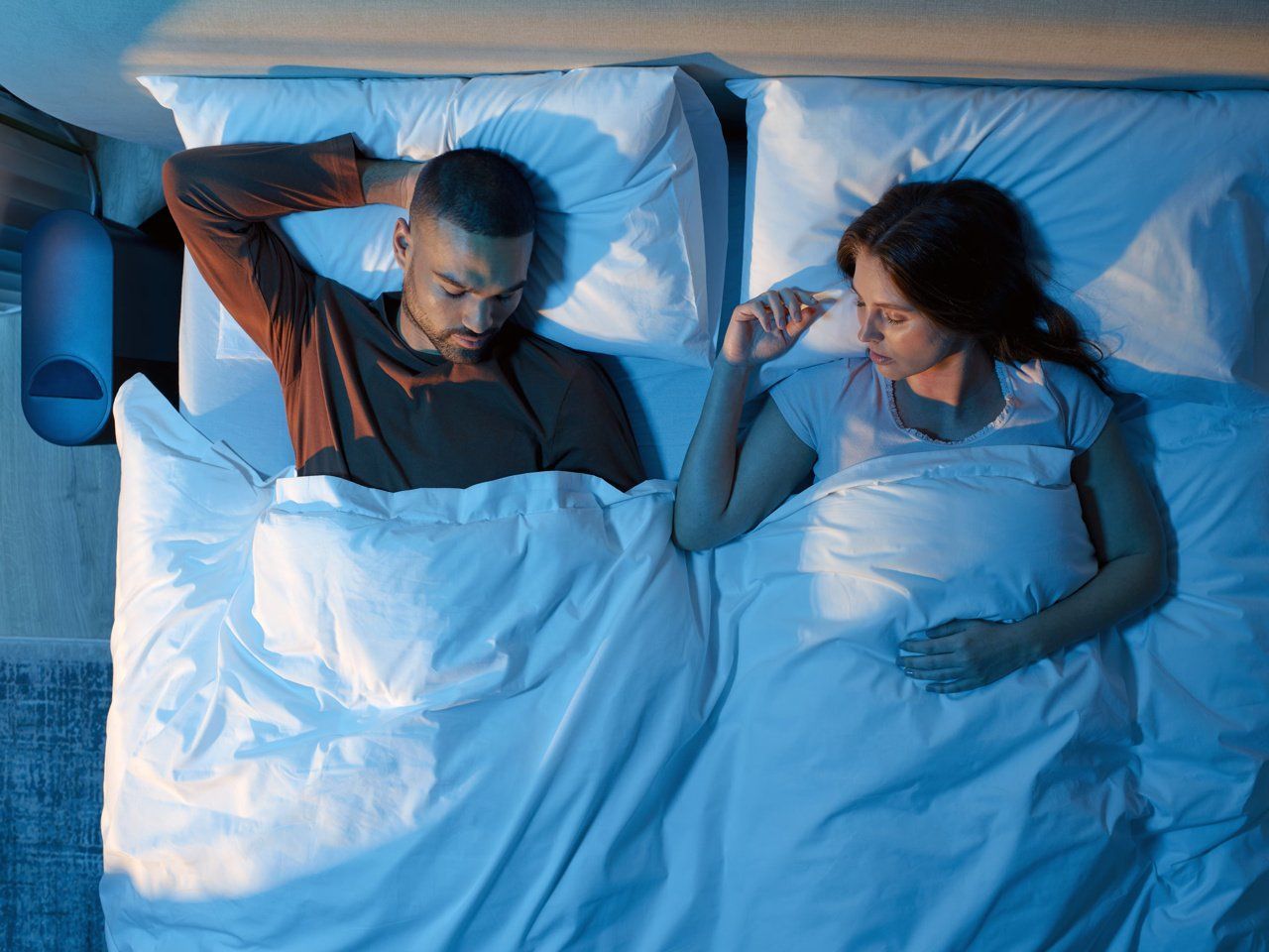 Couple sleeping on mattress by eightsleep large