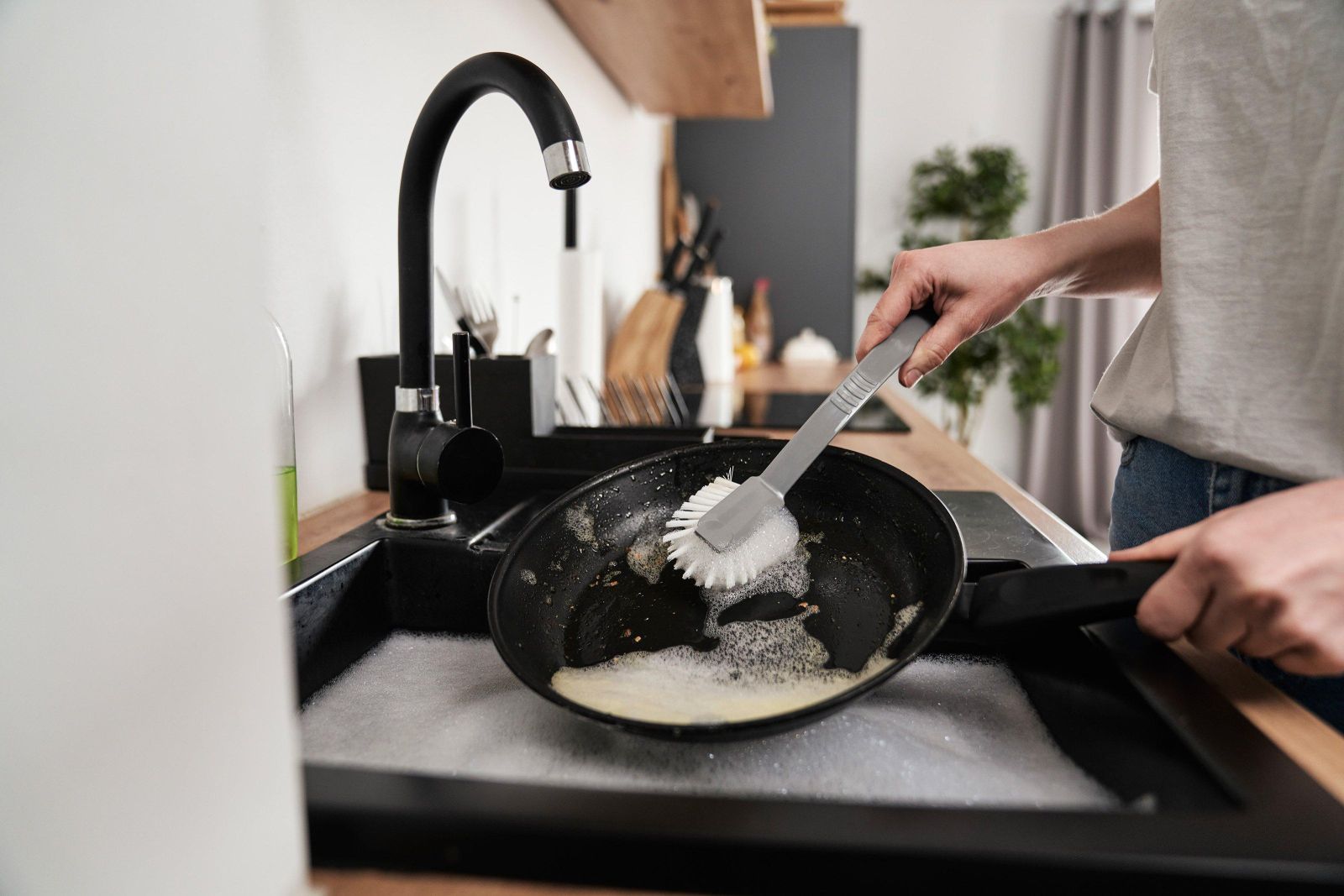 Close up of caucasian woman washing the pans 2023 11 27 05 12 35 utc